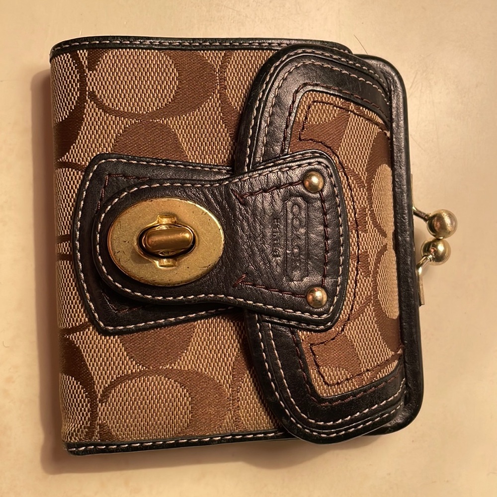 Brown/tan Coach wallet with coin purse/ credit card slots/and cash holder.